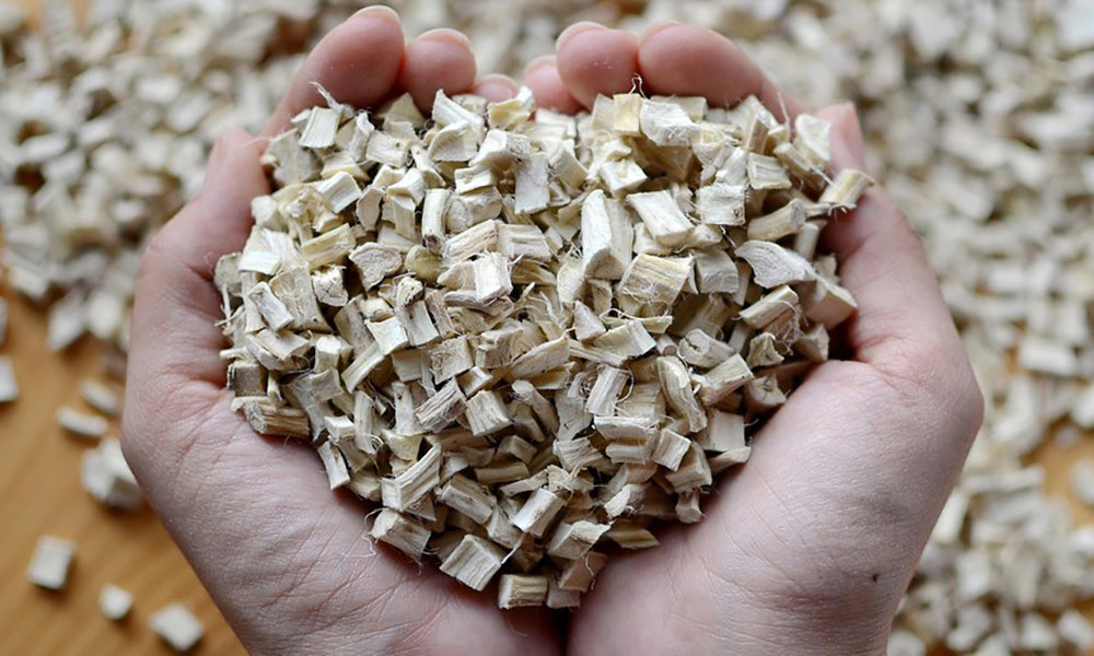 diced, dried marshmallow root scooped in two hands